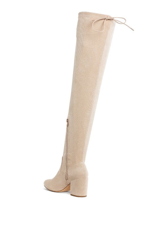 Beige knee-high boot on a white background