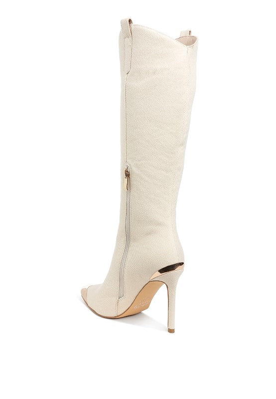 White knee-high boot with a stiletto heel on a white background