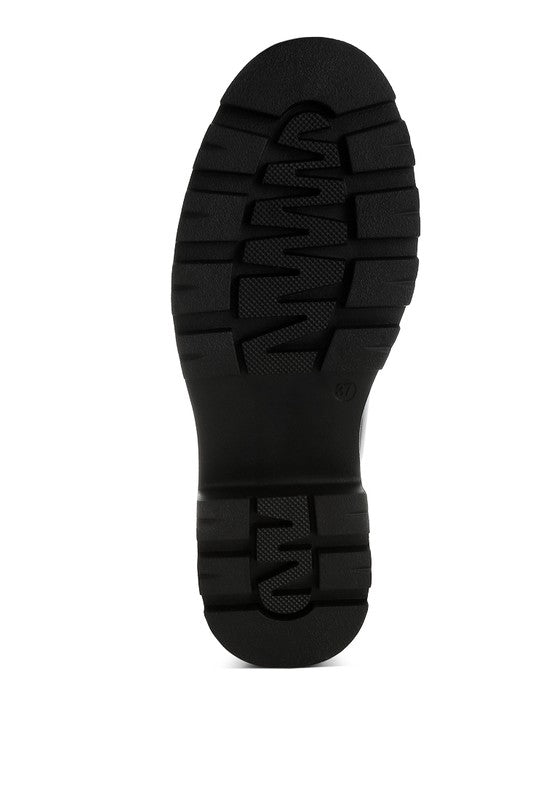 Black boot sole on a white background