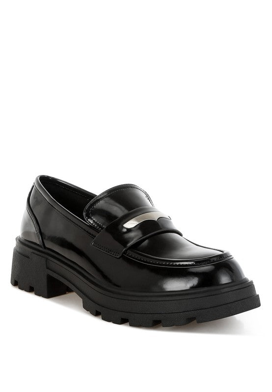 Black glossy loafer shoe on a white background