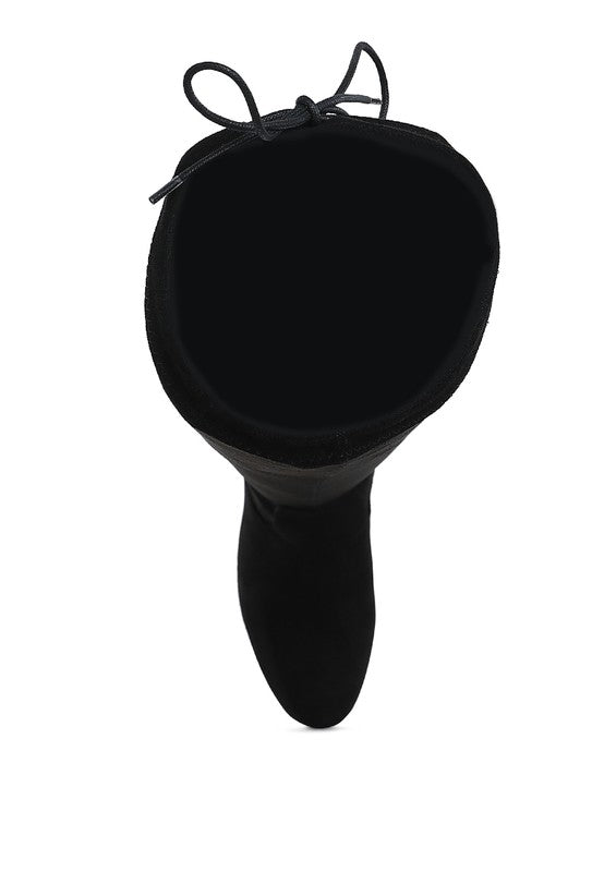 Black silicone butt plug with a bow on a white background