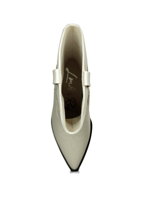 White high-heeled shoe with a pointed toe on a white background