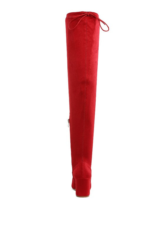 Red over-the-knee boot on a white background