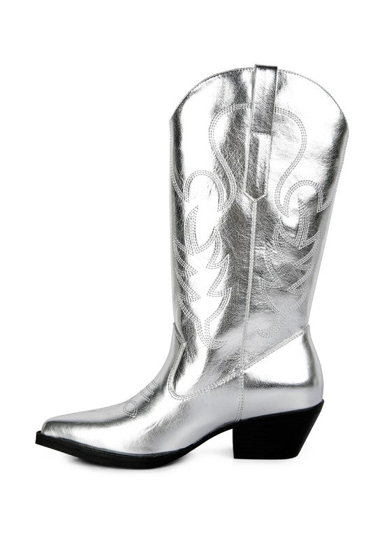 Silver cowboy boot with intricate designs on a white background