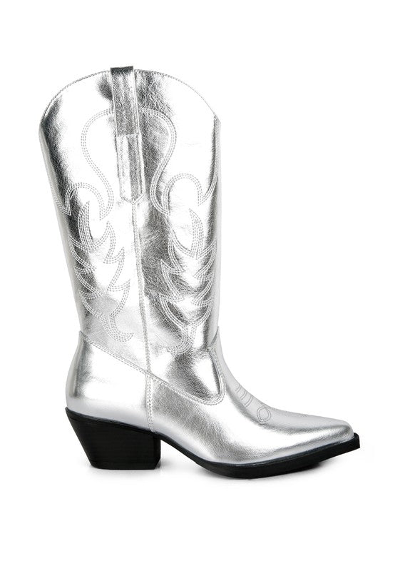 Silver cowboy boot with intricate designs on a white background