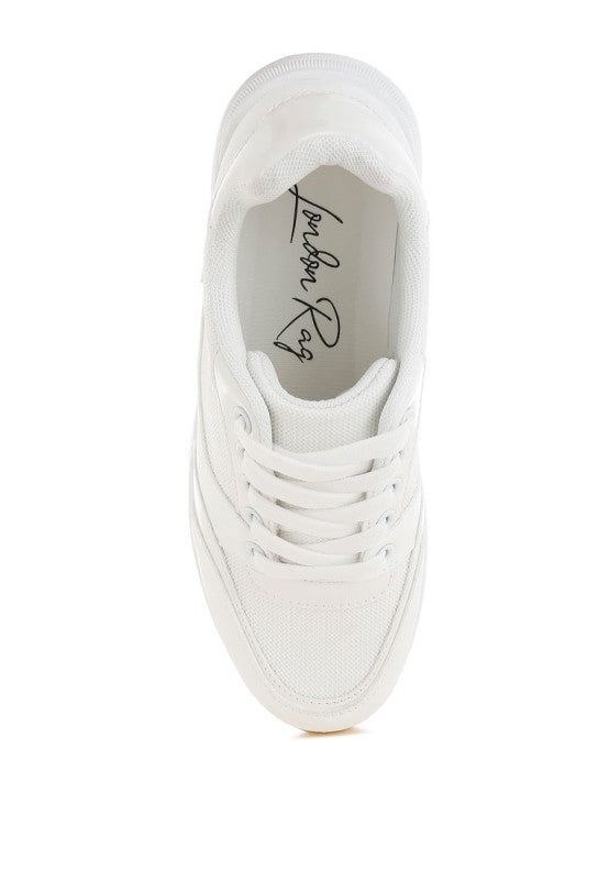 White sneaker with brand logo on a white background